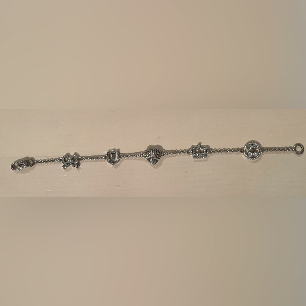 Slightly used but in great condition juicy couture 5 charm bracelet.